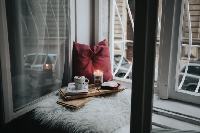 A hygge corner of a room with a custom photographic wallpaper